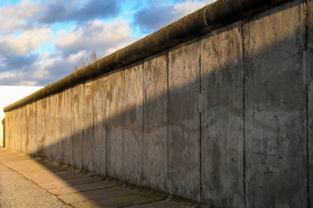 istock Part of Berlin Wall or Berliner Mauer with blue sky 2200123110