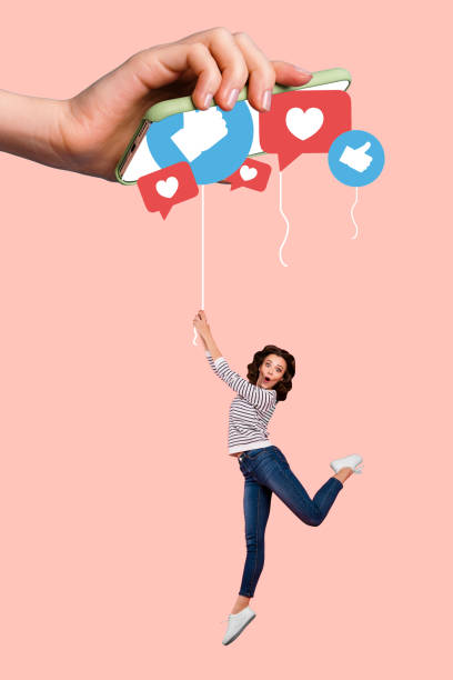 istock Vertical photo collage of happy girl fly string han hold iphone device screen pour likes reaction thumb up isolated on painted background 2200129075