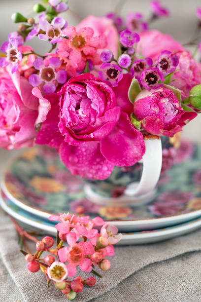 istock Close-up floral composition with a pink roses. Many beautiful fresh roses on a table.Soft focus. 2200130113
