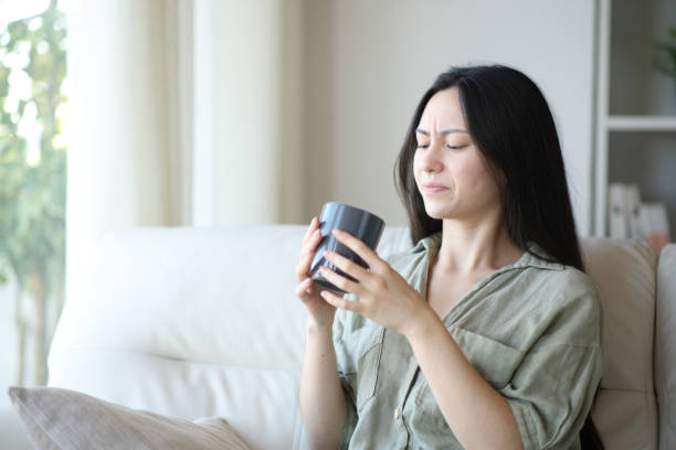 istock Asian woman complaining about coffee bad taste 2200131458