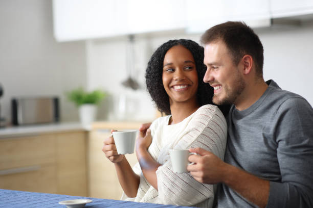 istock Happy couple in love looking each other at coffee time 2200131752