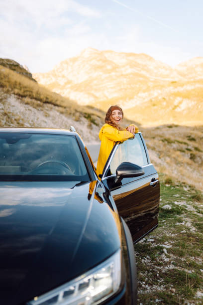 istock Stop during a journey. Young woman enjoying nature. 2200131834