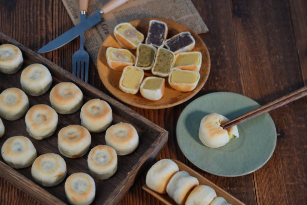 istock Chinese desserts and pastries placed in various containers on the table 2200132303