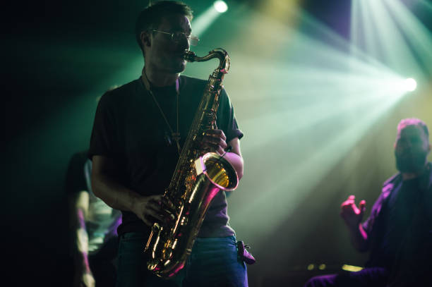 istock Saxophonist performing live on stage with passion and skill 2200132466