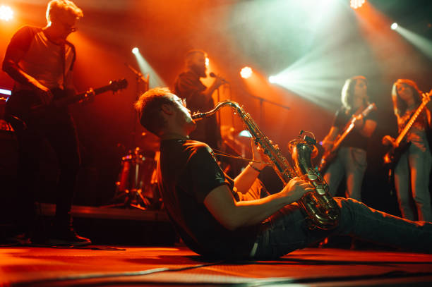 istock Saxophonist performing with passion on stage at a concert 2200132478
