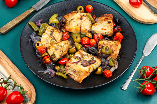 istock Baked mackerel stuffed with vegetables. 2200132703