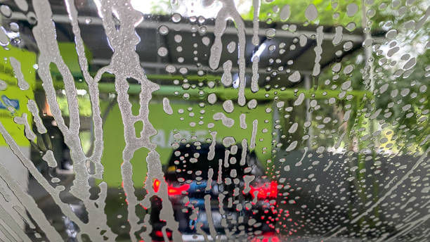 istock Washing soap foam sticks to the car windshield 2200133234