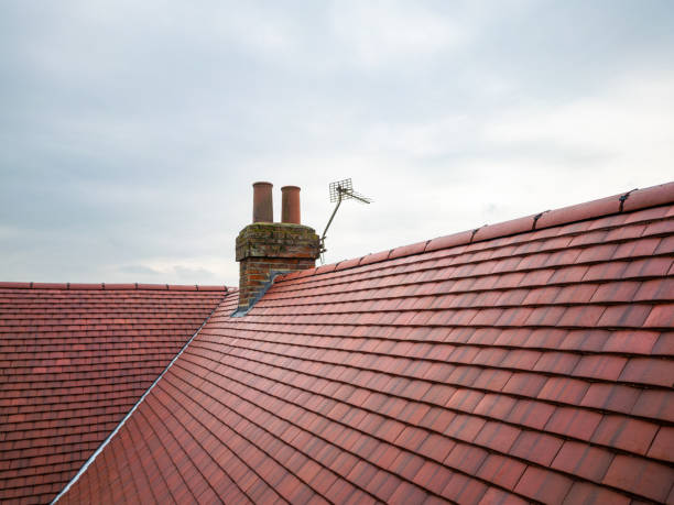 Inspection drone view of a newly installed ceramic roof on an old English farmhouse. stock photo