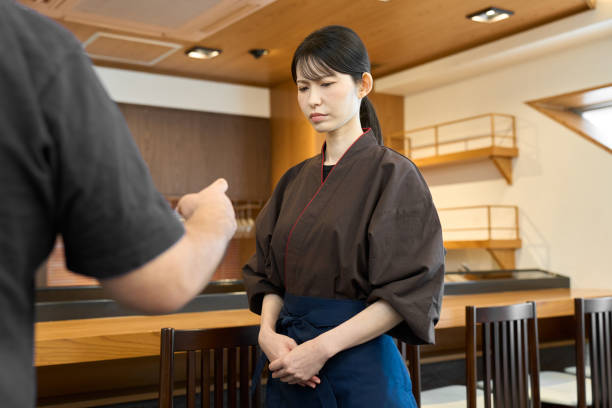 istock A Japanese restaurant employee with a displeased expression 2200133722