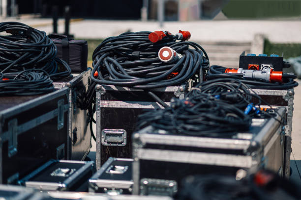 istock Audio cables lying on storage cases outdoors 2200133853