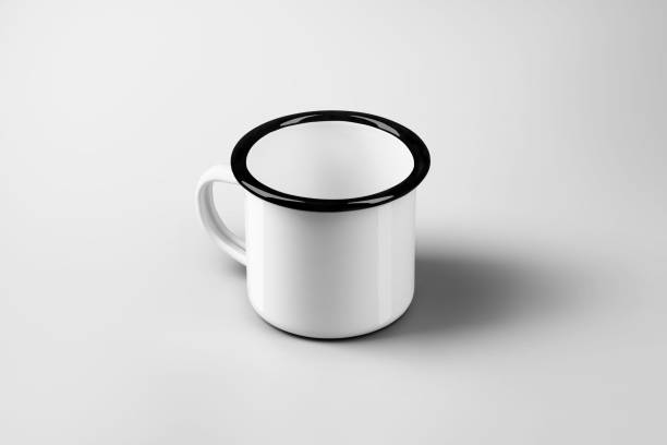 istock Mockup of enamel white mug with black rim, handle, top view, empty cup isolated on background. 2200134428