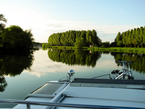 istock Tranquil scene of a river boat with bicycles on the deck 2200137178