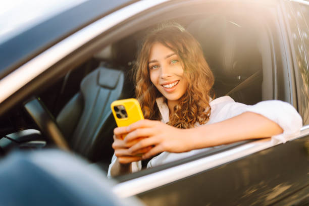 istock Female driver use smart phone in the car. 2200137764