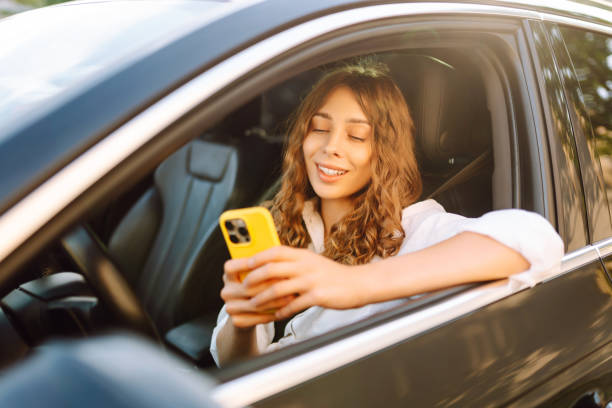 istock Female driver use smart phone in the car. 2200137772