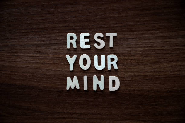 Rest your mind - Wooden letters on walnut background