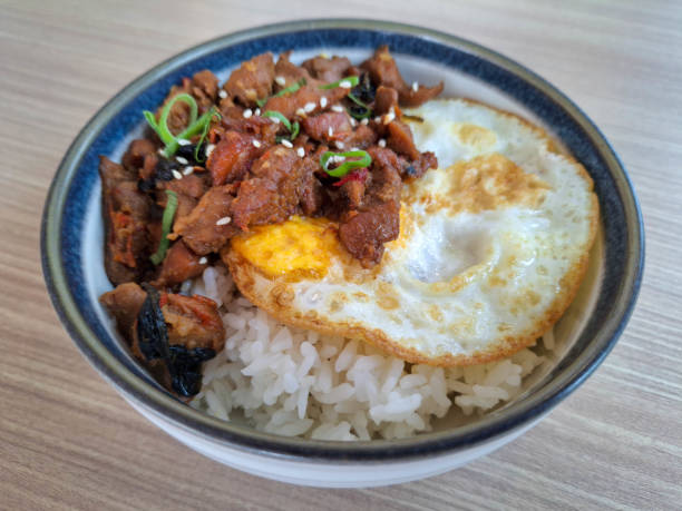 istock Chicken Thai Basil Rice Bowl With Minced Chopped Chicken, Steamed Rice, Omelette Eggs, Leek And Sesame Seed. Food Menu. 2200139452