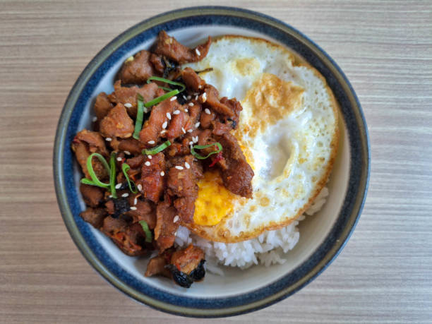 istock Yummy Chicken Thai Basil Rice Bowl With Minced Chopped Chicken, Steamed Rice, Omelette Eggs, Leek And Sesame Seed. Food Menu. Top View. 2200140208