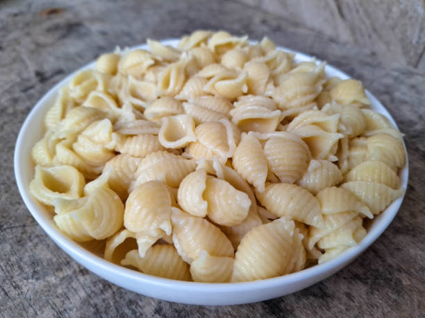 istock Tasty Shell Conchiglie Macaroni Pasta On A Plate. Food Menu. 2200142414