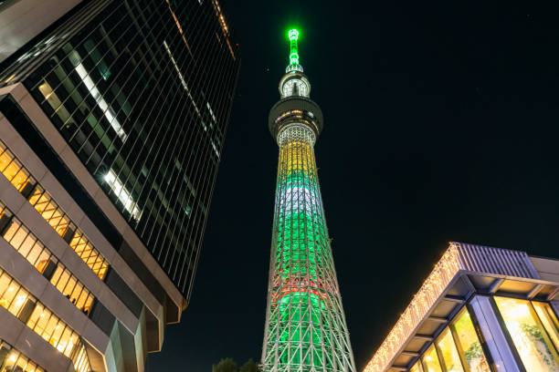 Looking up at Tokyo Sky Tree tower with a starry night sky
