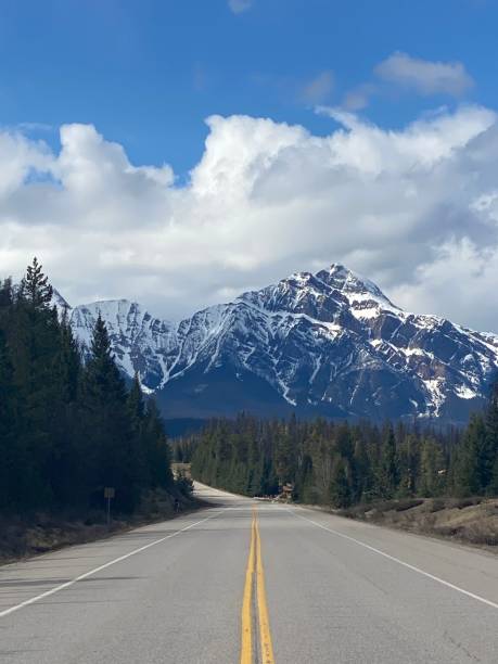 istock Scenic road to snow-capped mountains 2200143267