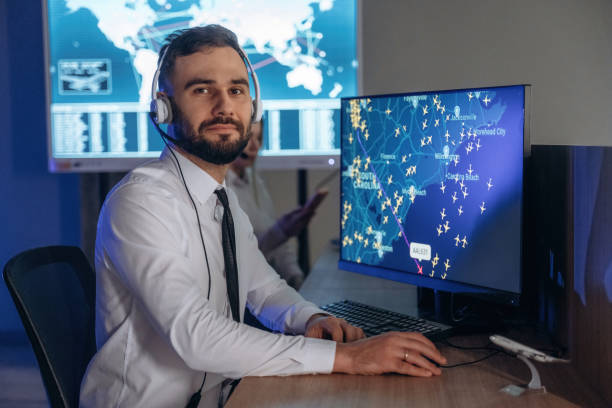 istock Looking at the camera. People are working by computers in airline company 2200146177