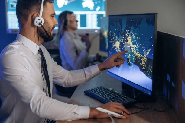 istock Map on the display. People are working by computers in airline company 2200146192
