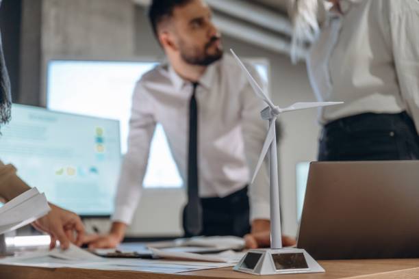 istock Two employees are working in wind turbine company 2200146476