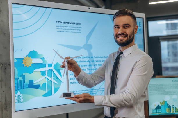 istock Ecology conception. Man is working in the wind turbine company 2200148813