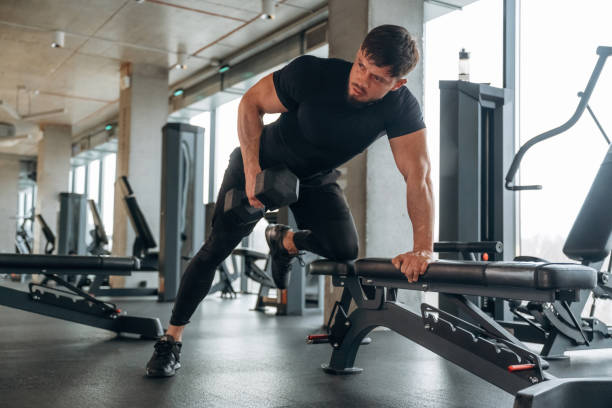 istock Triceps exercise. Man is in the modern gym 2200149813