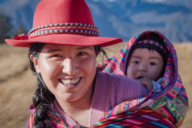 istock Peruvian woman crossing a field, Urubamba Valley 2200150436