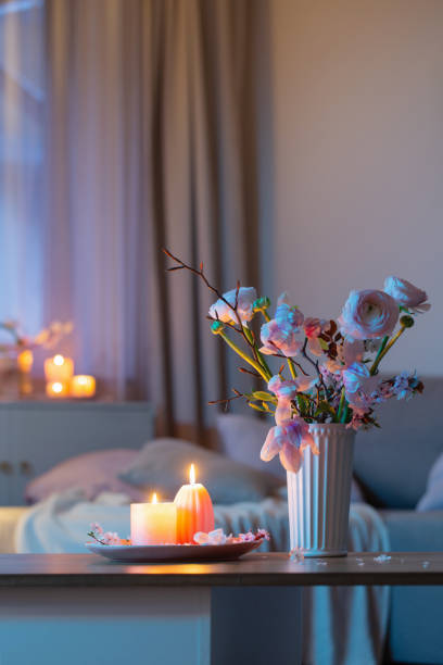 istock home interior with spring flowers and burning candles 2200151500