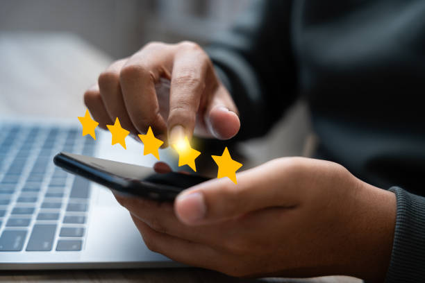 istock Experience excellent customer service, User give five star rating on online application, Positive feedback, Happy, Smiley face icon. Customer Reviews in Digital Survey, Satisfaction. 2200154913