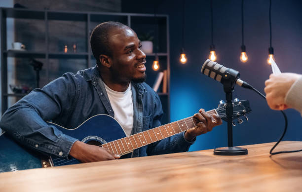 istock Two radio presenters recording an audio broadcast in a studio 2200155828