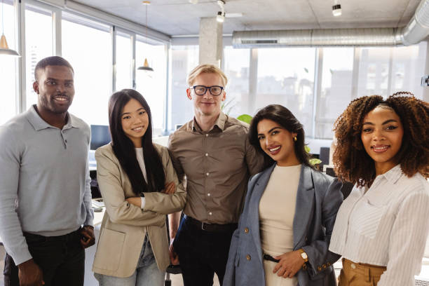 istock Diverse business team smiling together in modern office 2200157523
