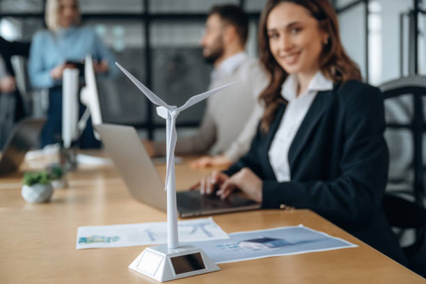 istock Side view, by the table. Business people are working in the office 2200158449