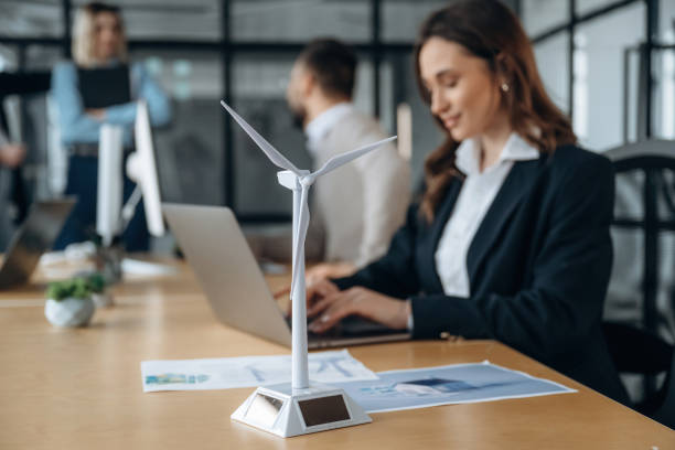 istock Side view, by the table. Business people are working in the office 2200158456