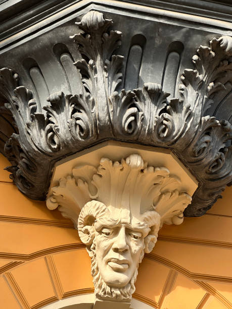 istock Ornate statue head on an old building 2200159559