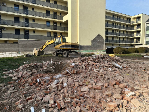 istock Construction vehicle at the place of a demolished building 2200159596