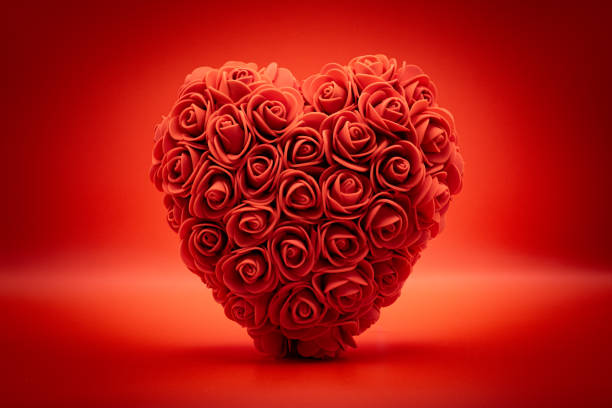 Valentine red rose bouquet on rustic wooden table. Getty Images Valentine’s Brief 603393001