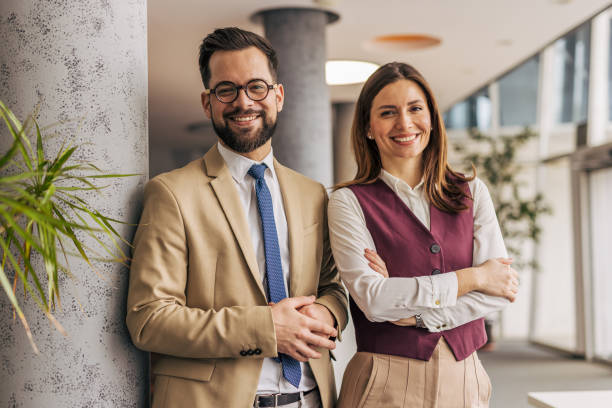 istock Confident business professionals smiling in office 2200160704