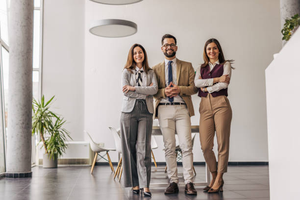 istock Confident business team standing in modern office 2200161376