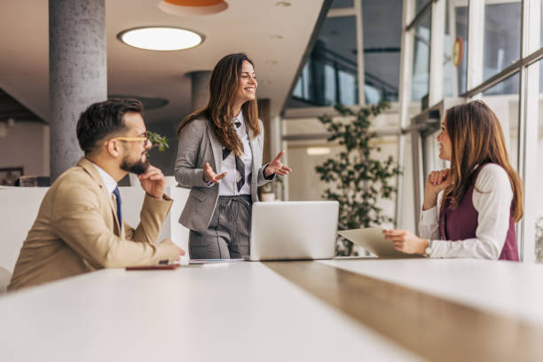 istock Young professionals engaging in a modern office meeting 2200162356