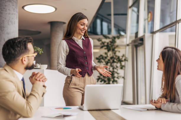 istock Confident businesswoman leading team discussion 2200162534