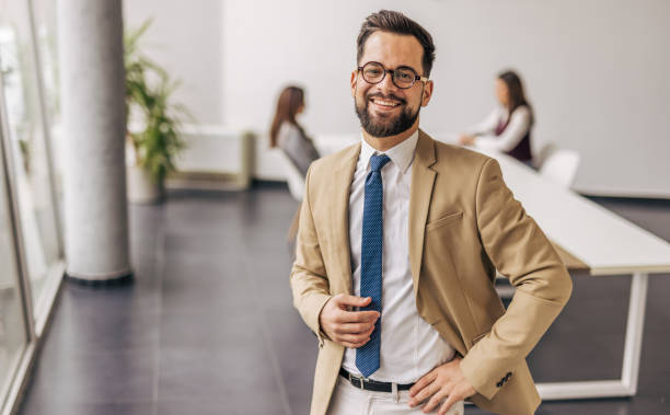 istock Confident businessman smiling in modern office 2200162570