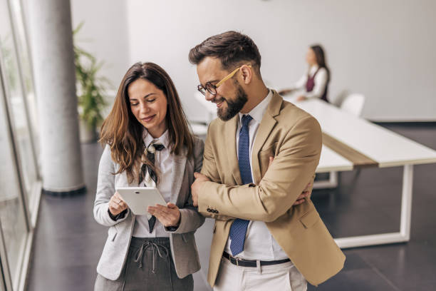 istock Business colleagues using digital tablet in modern office 2200162783