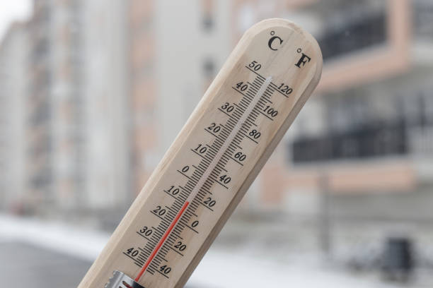 istock Thermometer showing below Zero degree Celsius temperature outdoor in the city 2200164954