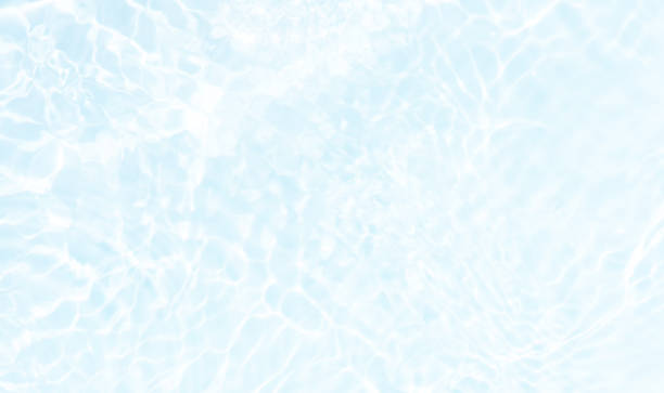 istock Blue water with ripples on the surface. Defocus blurred transparent blue colored clear calm water surface texture with splashes and bubbles. Water waves with shining pattern texture background. 2200167966