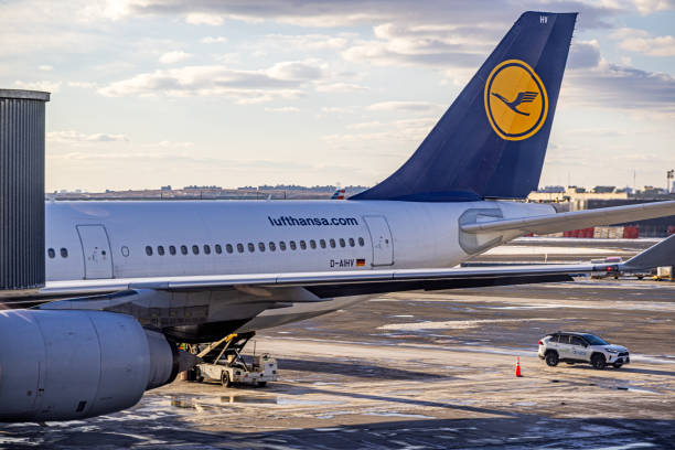 Terminal 1 - JFK airport, New York, United States - January 20th 2025:  Backend of an Airbus 340 parked at the airport terminal on a day with snow on the tarmac