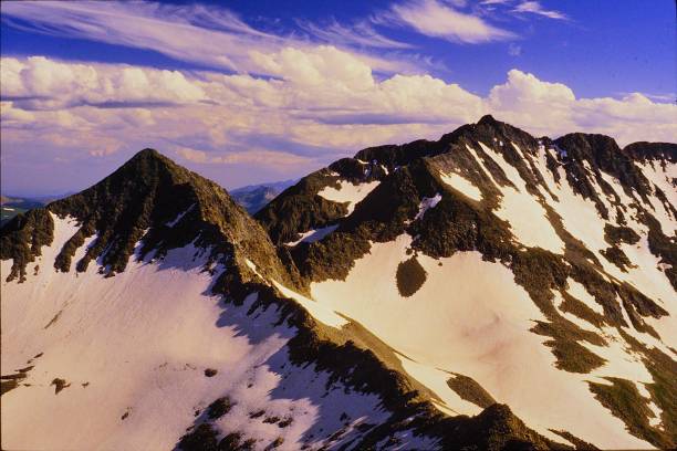 istock Beautiful Views abound when Climbing Wilson Peak and El Diente in the San Miguel Range of Colorado near Telluride in the Rocky Mountains July 1983.  Mt Wilson from Wilson Peak. 2200169811