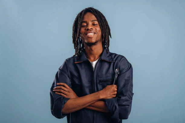 istock Plumber with tools, wrench. Black man is in the studio against soft background 2200170397